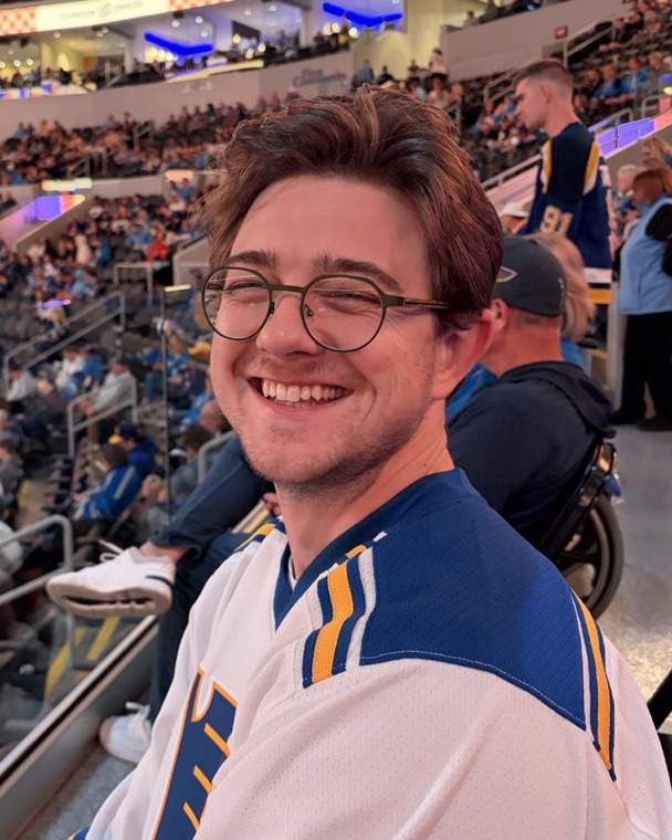 Austin Burgard, smiling, at a St. Louis Blues game